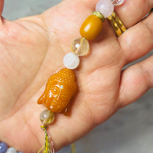 Radiant Buddha Talisman with gemstones

