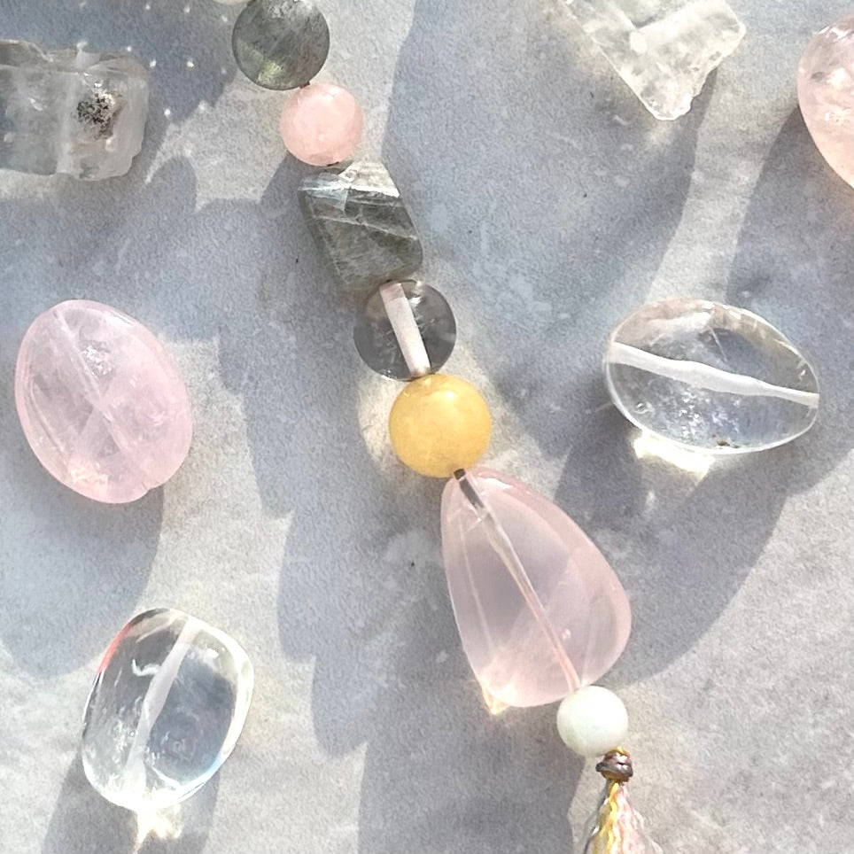 Rose quartz talisman with gemstones