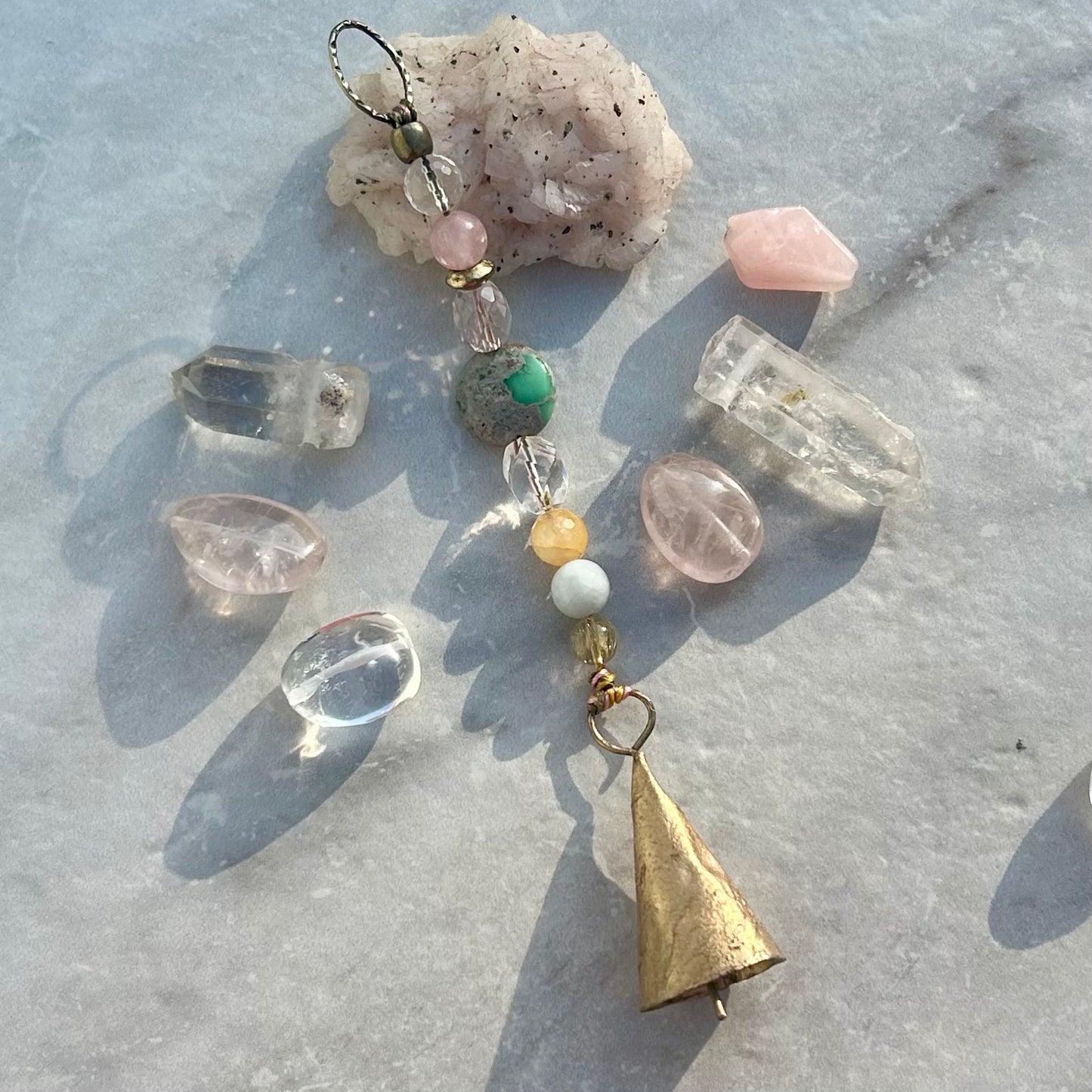 sacred sound bell talisman with gemstone accents